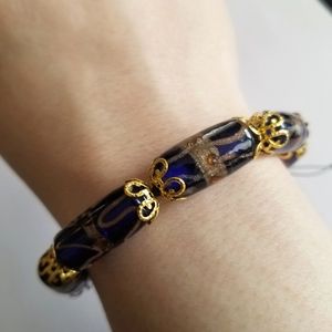 Handmade beaded bracelet cobalt blue art glass beads gold tone black cord